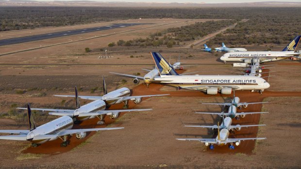 Singapore Airlines is storing some of its grounded aircraft near Alice Springs, while Qantas has opted to send its planes to California for long-term storage.