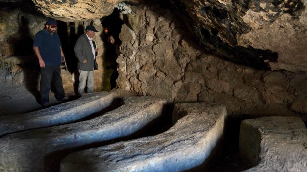 Yehuda Shaul, left, co-founder of Israeli group Breaking The Silence, and Colm Toibin inspect a cave where 34-year-old Palestinian Nasser Nawaja said he was born.