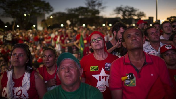 Government supporters in Brasilia watch on a large screen as legislators  vote on whether or not to impeach President Dilma Rousseff.