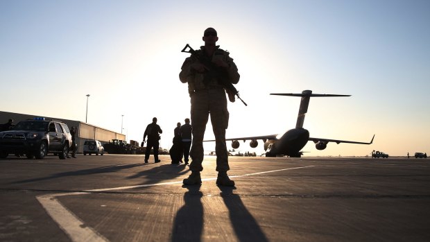 A US soldier stands guard near a C17 military aircraft ... The Pentagon has raised its security level in relation to possible terrorist attacks on its bases.