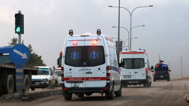 Ambulances leave the King Abdullah bin Al Hussein Training Centre on the outskirts of Amman, Jordan, where a Jordanian policeman  opened fire on foreign trainers at a police compound, killing two Americans, one of them Lloyd "Carl" Fields, a South African and a Jordanian.