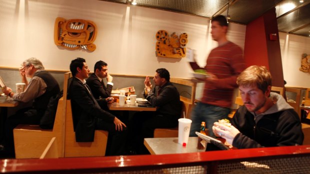 Diners eat at a Chipotle restaurant in Chicago.