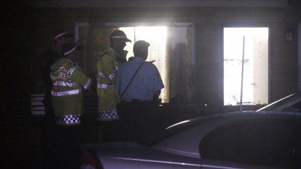 One woman is in police custody after an elderly woman was found dead in a Freshwater unit.
