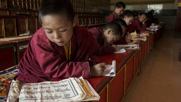 Young monks practice writing Tibetan at a monastery in Yushu, China, earlier this year. 
