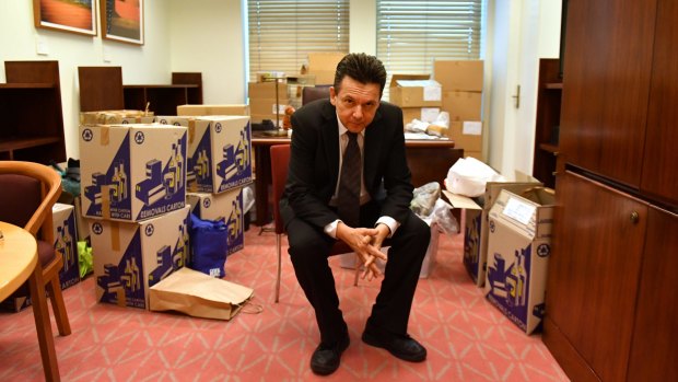 Nick Xenophon Team leader Senator Nick Xenophon sits in his office with packing boxes.