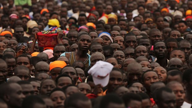 Thousands of Burundians listen to President Pierre Nkurunziza campaigning on Thursday in Busoni, Burundi.