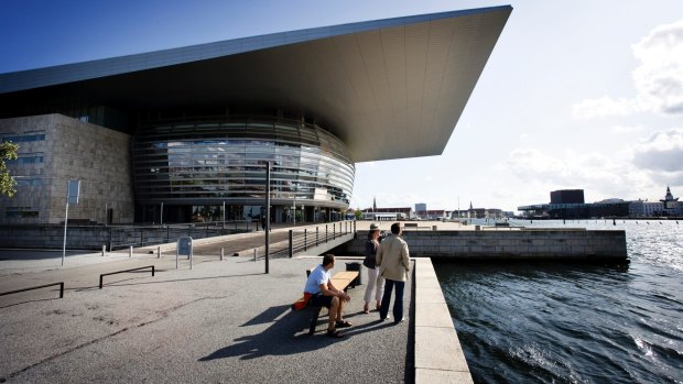 Costing about US$500 million, the Copenhagen Opera House was designed in so-called "neo-futuristic" fashion by the late Danish architect Henning Larsen, who trained with Utzon. It was panned by critics when it opened in 2004. Some dismissed it as a spaceship or the grille of a vintage Pontiac car.