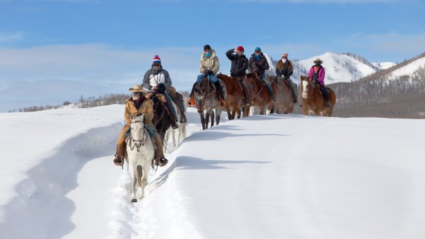 What do you do when you're in a cowboy town in the middle of winter? Why, you saddle up and join them on a ride through the snow of course.
