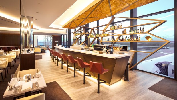 Planespotters get a prime view from the bar at 'The House' in Melbourne Airport's international terminal. 