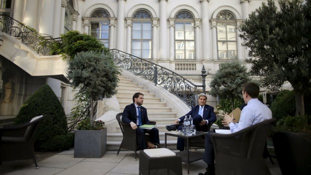 US Secretary of State John Kerry and members of the US delegation at the garden of the Palais Coburg hotel where the Iran nuclear talks meetings are being held in Vienna.