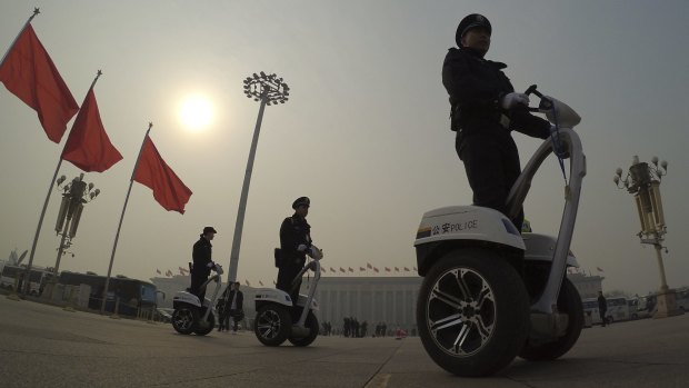 Policemen patrol Tiananmen Square on Thursday. 