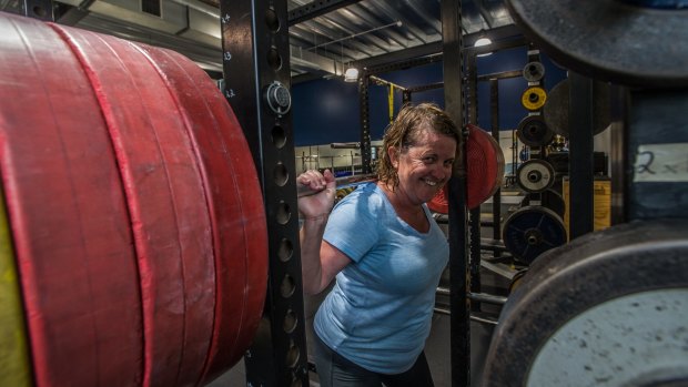 200 club challenge: Karen Hardy has a go at lifting a 200kg barbell.