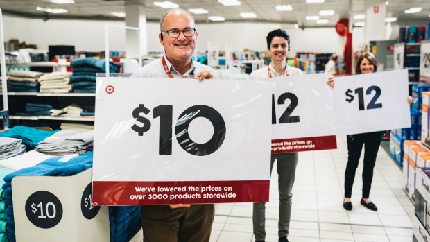 Target's Peter van Gestel, Bradley Chapman and Ann-Maree Miller with signage ahead of the boxing day sales.