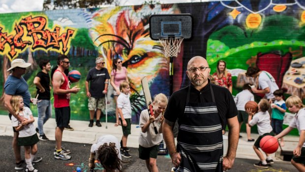 Alex Piris who is the owner of Fox and Bow Cafe, at Farrer, is unhappy about the ACT government asking him to remove the cafe's basketball hoop.