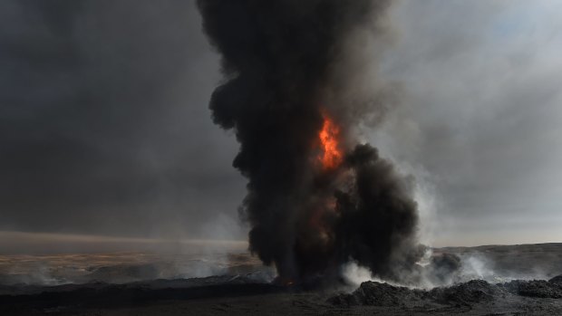 When ISIS retreated from the Iraqi town of Qayyarah they set fire to the oil wells sending up plumes of toxic black and white smoke that blanket the sky.