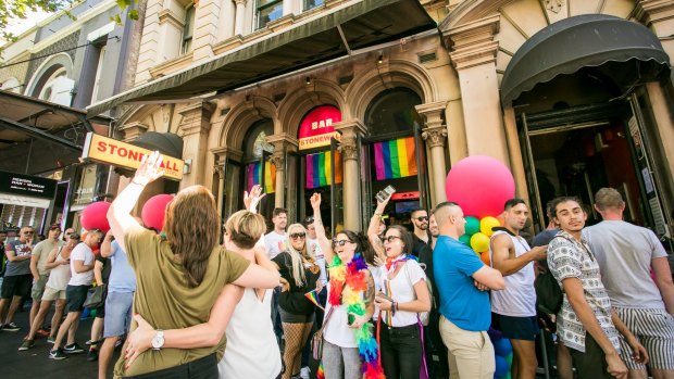Supporters of same-sex marriage celebrate the "yes" verdict at the iconic Stonewall Hotel on Sydney's Oxford Street.