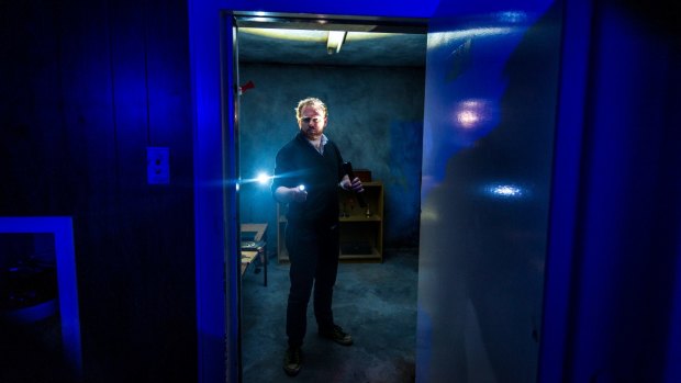 Ben McKenzie, game designer of the Small Time Criminals bank robbery role play, pictured in the vault of a former Preston bank. 