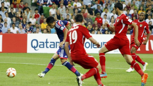 Shinji Kagawa (left) gets Japan's second goal with eight minutes left in the game.