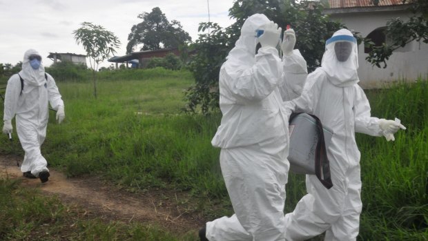 Liberian health workers deployed to take blood specimens to test for Ebola on Tuesday after a teenager died of the virus.
