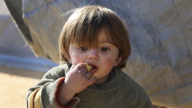 A displaced Syrian boy on Monday  at a temporary refugee camp in northern Syria, near Bab al-Salameh border crossing with Turkey.