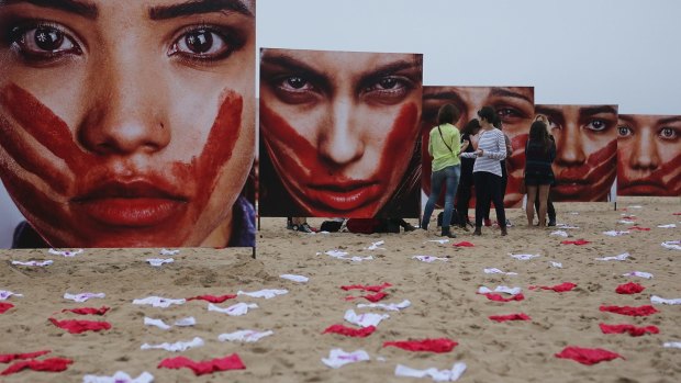 Brazilian photographer Marcio Freitas' Copacabana beach installation shows models portraying abused women along with 420 pairs of underwear representing the number of women raped in the country every 72 hours. 
