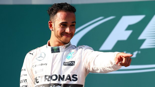 Lewis Hamilton celebrates on the podium after winning the Australian Formula One Grand Prix on Sunday.
