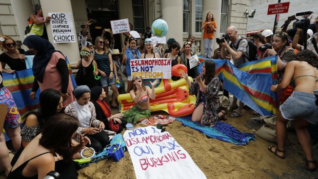 Activists protest the burkini ban outside the French embassy in London.
