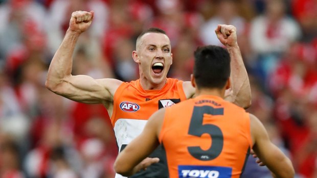 Delighted: Tom Scully and Dylan Shiel celebrate during the 2016 AFL first qualifying final between the Sydney Swans and the GWS Giants at ANZ Stadium.