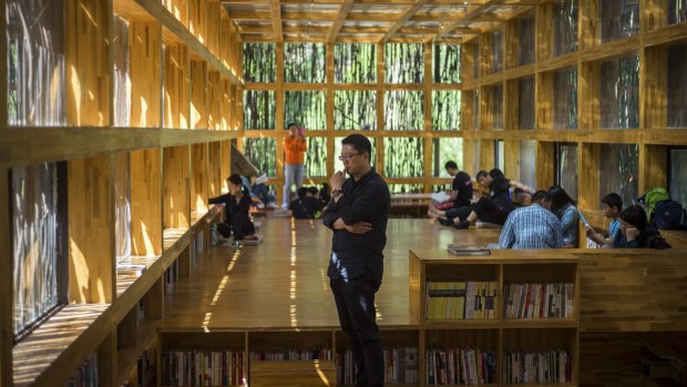 Li Xiaodong, centre, an architect, inside his Liyuan library in Jiaojiehe, near Beijing, was captivated by the potential he saw in the village's most abundant natural resource.