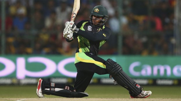 Hitting out: Usman Khawaja swings hard for Australia against Bangladesh.