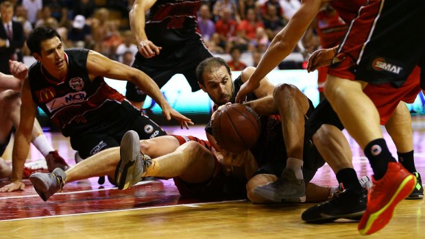 Dogfight: Hawks guard Rhys Martin scrambles for the ball during the NBL semi-final between Illawarra and the Perth Wildcats at Wollongong Entertainment Centre.