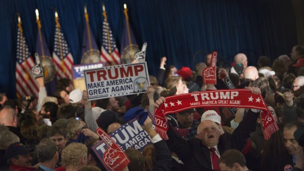 Trump supporters celebrate winning the New Hampshire primary.