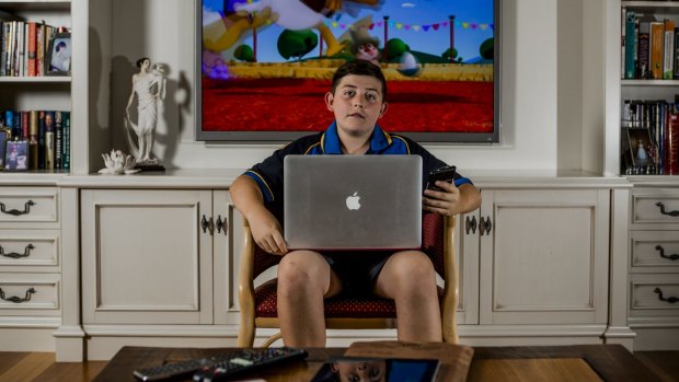 Hamish Insley, 12, has a variety of devices he uses to access the internet.
