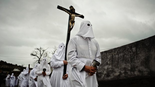 Penitents take part in the Good Friday 'Del Santo Entierro' procession in the small village of Bercianos de Aliste, northern Spain
