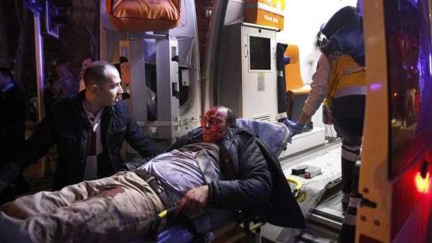 Paramedics carry a wounded man from the site of an explosion in Ankara on  Wednesday.