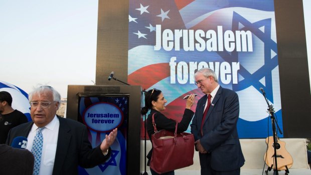 David Friedman (far left) gives interviews at a Trump campaign event entitled "Jerusalem forever" in East Jerusalem in October.