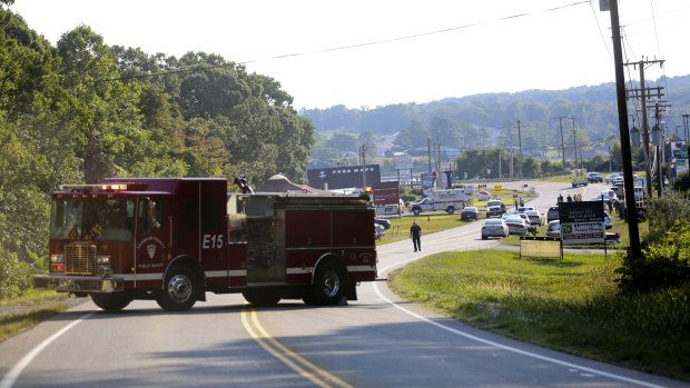 Authorities block Virginia State Route 122 at Bridgewater Plaza in Moneta, Virginia, after two journalists were fatally shot while broadcasting live from the plaza earlier in the day.
