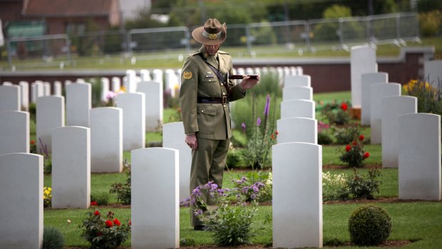 A lone Australian soldier pays his respects at Fromelles. 
