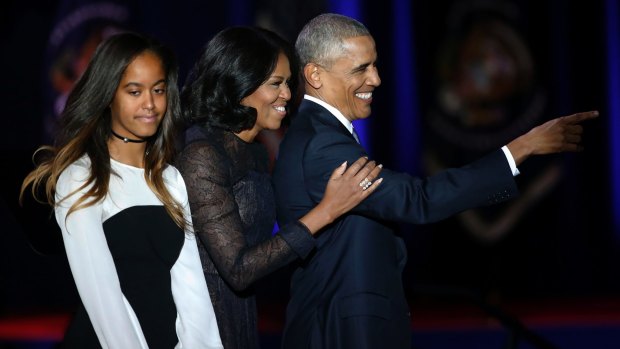 President Obama is joined by first lady Michelle Obama and daughter Malia after his farewell speech in Chicago on January 10, 2017.