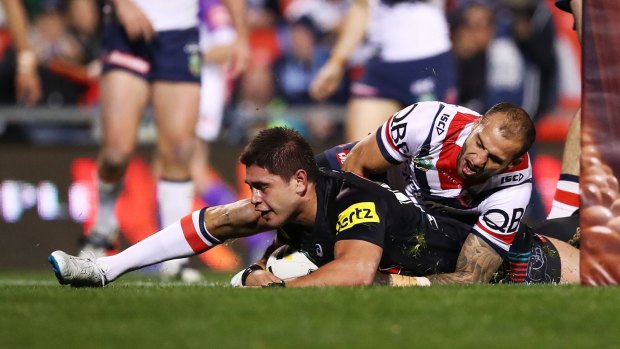 Sliding into home: Chris Grevsmuhl scores a try during the round 22 NRL match between the Penrith Panthers and the Sydney Roosters at Pepper Stadium.