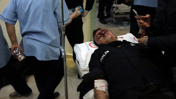 A wounded police officer at an Istanbul hospital after the blasts near the Besiktas stadium. Most of the dead were riot police.