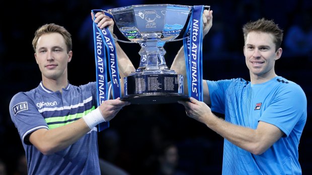 Henri Kontinen of Finland, left, and John Peers of Australia pose after winning their ATP World Tour Finals doubles final. 