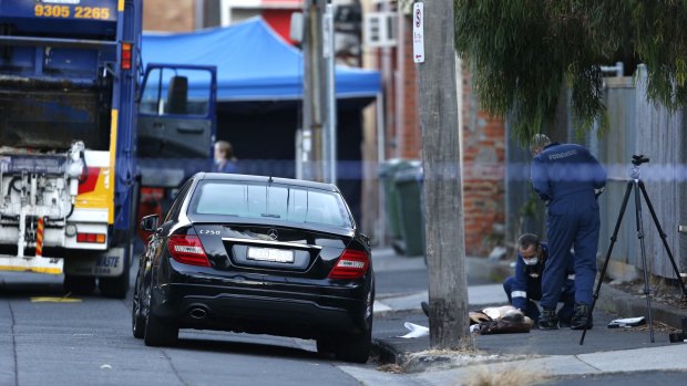 Victoria Police and State Emergency Service workers at the scene where the body of Joseph Acquaro was found in Brunswick East on Tuesday.