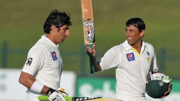 Younis Khan (right) and Misbah-ul-Haq, both with hundreds under their belts, return to the pavilion after Pakistan declared its first innings at 3 for 566.
