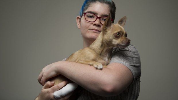Isabelle Goldstraw with her dog Flea after an attack by two dogs killed her other pet Chihuahua in her living room and left her with an injured finger. 