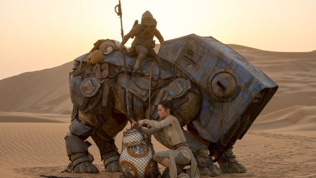 Rey (Daisy Ridley) and BB-8 in <i>Star Wars: The Force Awakens</i>.
