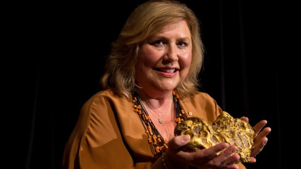 Australian Museum director Kim McKay with a 10-kilogram gold nugget that was in a box used as a cricket stump by Treasury officials.