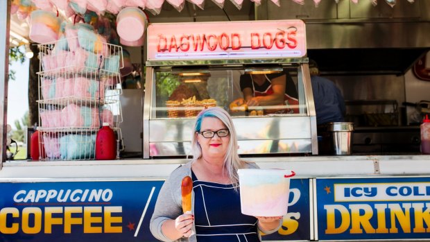 It's not a show experience without a Dagwood Dog - reporter Bree Winchester with her $8 dog and $10 bucket of fairy floss.