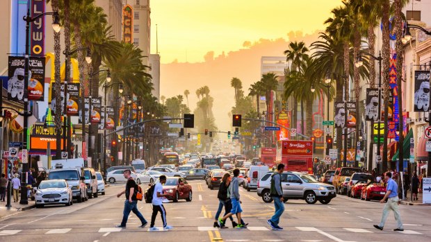 Hollywood Boulevard at dusk. The theatre district is famous tourist attraction. 
