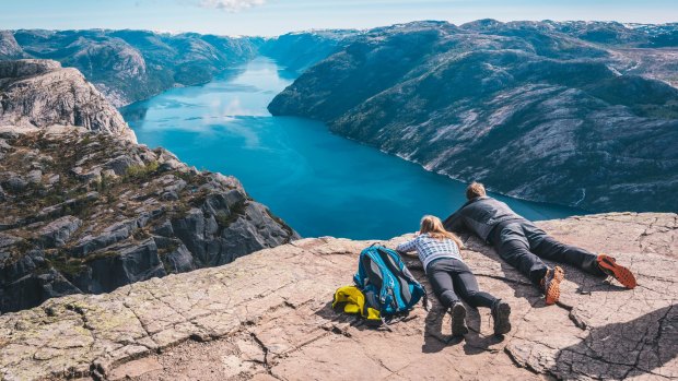 Colossal, light-coloured mountains crowd the fiord, some reaching to more than 1000 metres. 